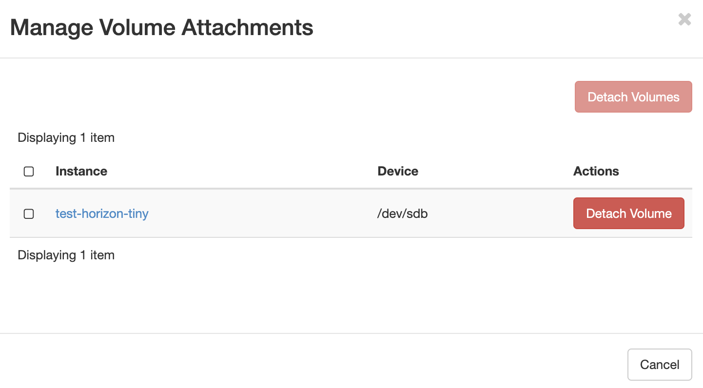 Screenshot of the "Manage Volume Attachments" modal. One volume named "test-horizon-tiny" is listed with a red "Detach Volume" button on the right.